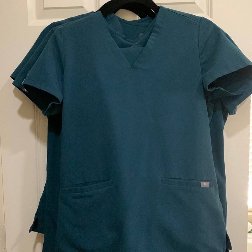 Four sets of top and bottom XS FIGS scrubs from the Technical Collection